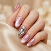 Hand with Stardust press on nails on a beige fabric background