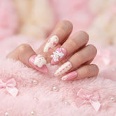 A close up picture of Kawaii Crisis press on nails in a pink enviroment